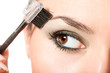 closeup shot of woman applying makeup