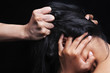 Hand grabbing woman's hair
