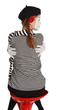 Mime girl hugging herself Mime girl hugging herself