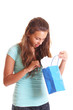 teen looking inside gift bag