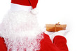 Santa Claus giving a golden gift