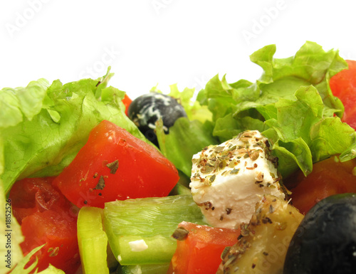 Photo: Greek salad with feta cheese, olives and fresh vegetables Greek salad with feta cheese, olives and fresh vegetables