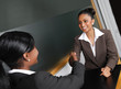 Photo: Multi-ethnic business team discussion with handshake Multi-ethnic business team discussion with handshake