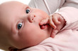 a young and beautiful baby in pink