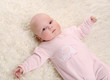 a young and beautiful baby in pink