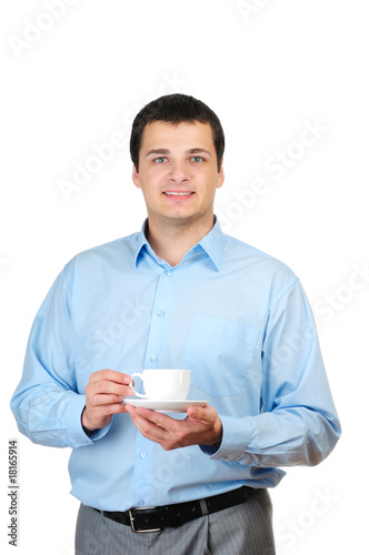 Photo: Young man holding cup of coffee (or tea) isolated on white Young man holding cup of coffee (or tea) isolated on white
