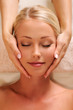 pretty female face getting relaxation massage of head pretty female face getting relaxation massage of head