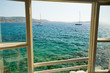 Window view on the bay of Mykonos, Greece