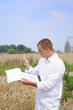 Environmental scientist in the field taking notes