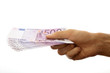 Euro banknotes in the men's hand. Isolated on white.