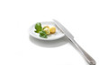 Three balls from oil, with mint, on a plateau. isolated on the w