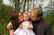 Cute Young Family Outside