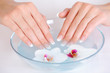 female putting her beautiful fingers into water female putting her beautiful fingers into water