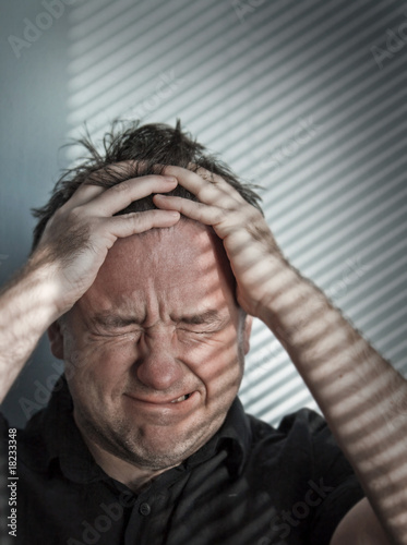 Photo: man crying real tears In a bad case of depression man crying real tears In a bad case of depression