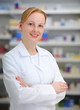 Photo: portrait of a female pharmacist at pharmacy portrait of a female pharmacist at pharmacy