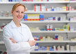 Photo: portrait of a female pharmacist at pharmacy portrait of a female pharmacist at pharmacy