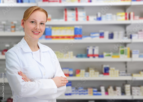 Photo: portrait of a female pharmacist at pharmacy portrait of a female pharmacist at pharmacy