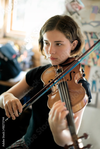 Photo: Pretty Young Woman Practicing Violin Pretty Young Woman Practicing Violin
