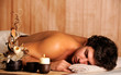 Young handsome man relaxing in spa salon