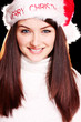 Pretty woman wearing santa hat