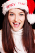 Pretty woman wearing santa hat