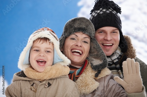 Family in snow at winter