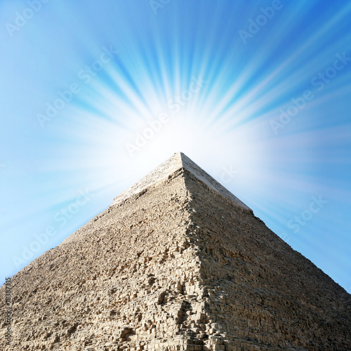 Photo: Egyptian pyramids with sun beams. Egyptian pyramids with sun beams.