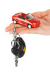 Hand with keys and car