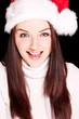 Pretty woman wearing santa hat