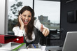 Pretty businesswoman doing OK sign
