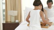 Children giving breakfast to their parents in bed