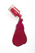 Photo: red nail polish splashed on white background red nail polish splashed on white background