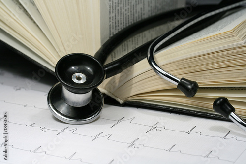 Photo: Book and stethoscope on an EKG printout Book and stethoscope on an EKG printout