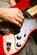 man playing electrical guitar