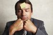 Sticky note on the forehead