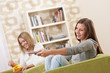 Students - Two female teenager watching television