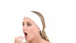 Young attractive female putting on make-up