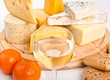Big group of cheese with wine, tangerines and bread Big group of cheese with wine, tangerines and bread