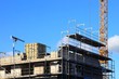 Baukrane, Krane, Hochbau, Hausbau, himmelblau