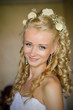 Beautiful smiling caucasian bride with bouquet