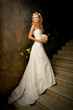 Beautiful smiling caucasian bride with bouquet