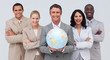 Business team holding a terrestrial globe