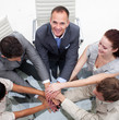 Close-up of multi-ethnic business team with hands together