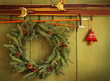 Old pair of skis hanging with wreath