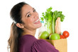 Young woman holding a grocery bag close up