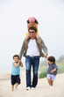 Happy father and kids walking