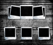 Blank photo frames on wood background