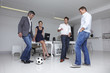 Business team playing football