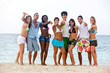 Beach people with thumbs up