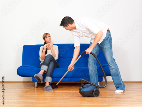 man homework with vacuum cleaner